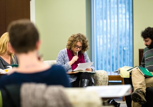 Professors working on a written assignment.